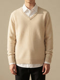 Ergora Alder fine-knit V-neck sweater in beige, worn over a white collared shirt