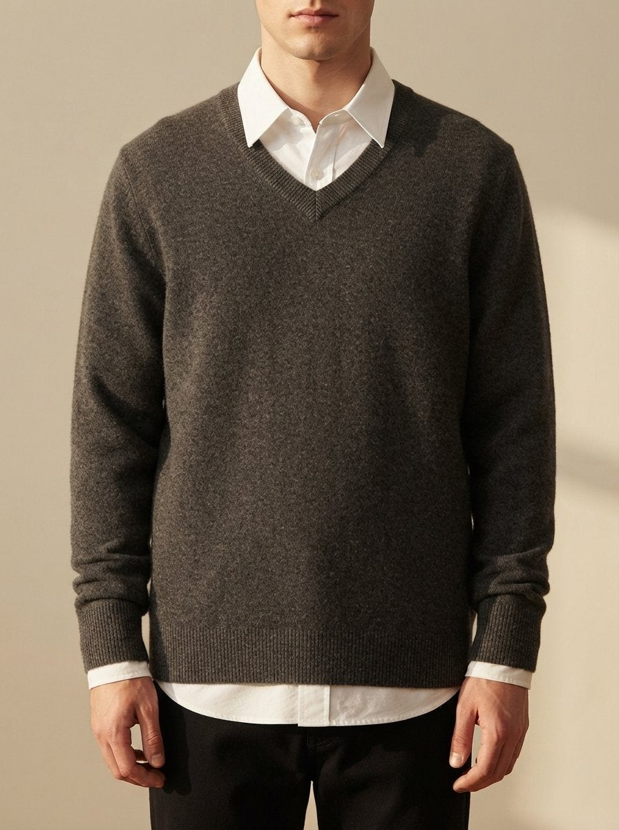 Ergora Alder fine-knit V-neck sweater in charcoal, worn over a white collared shirt